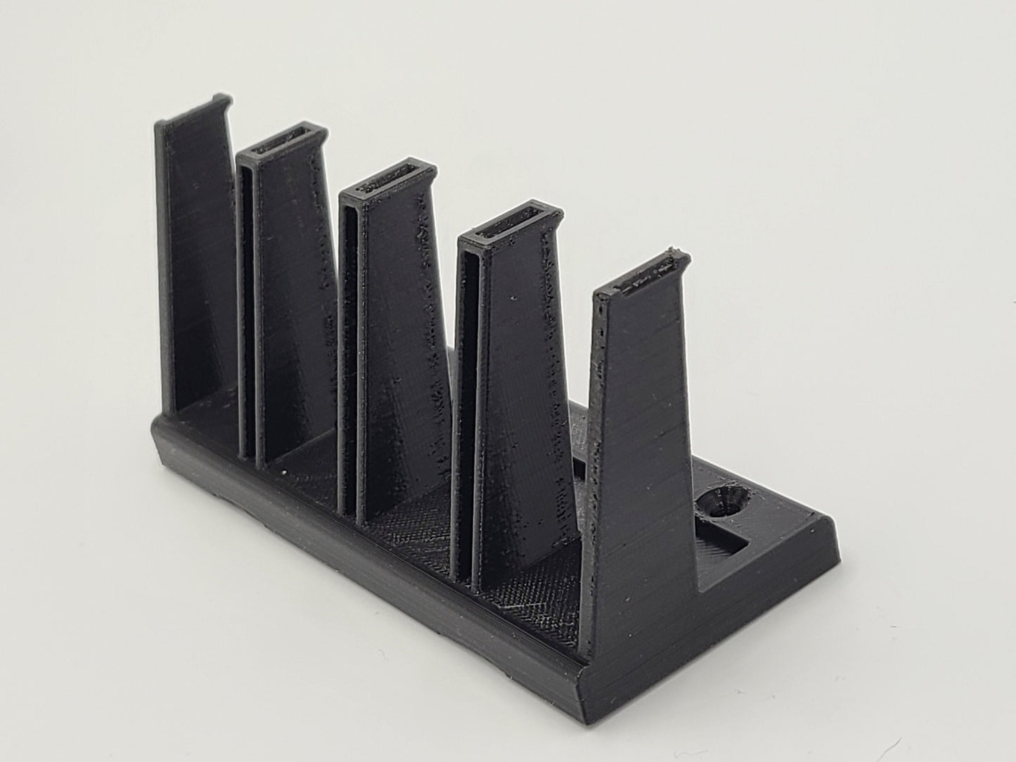 Magnetic multi caliber pistol magazine holder