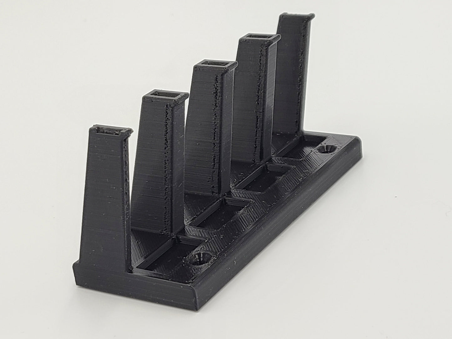 Magnetic multi caliber pistol magazine holder